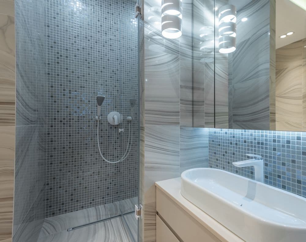 Modern bathroom with a glass shower enclosure and wall-mounted vanity